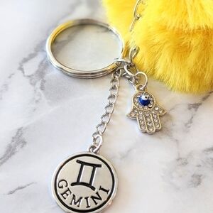 GEMINI Faux Fur Pom Pom Keychain with Hamsa  Hand